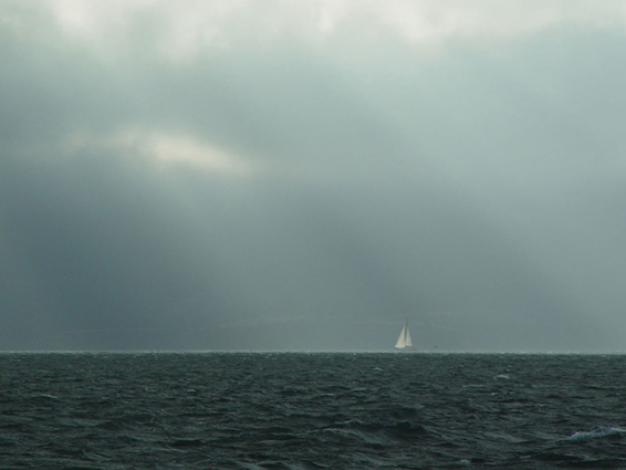 God Rays Over a Sailboat