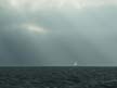 God Rays Over a Sailboat